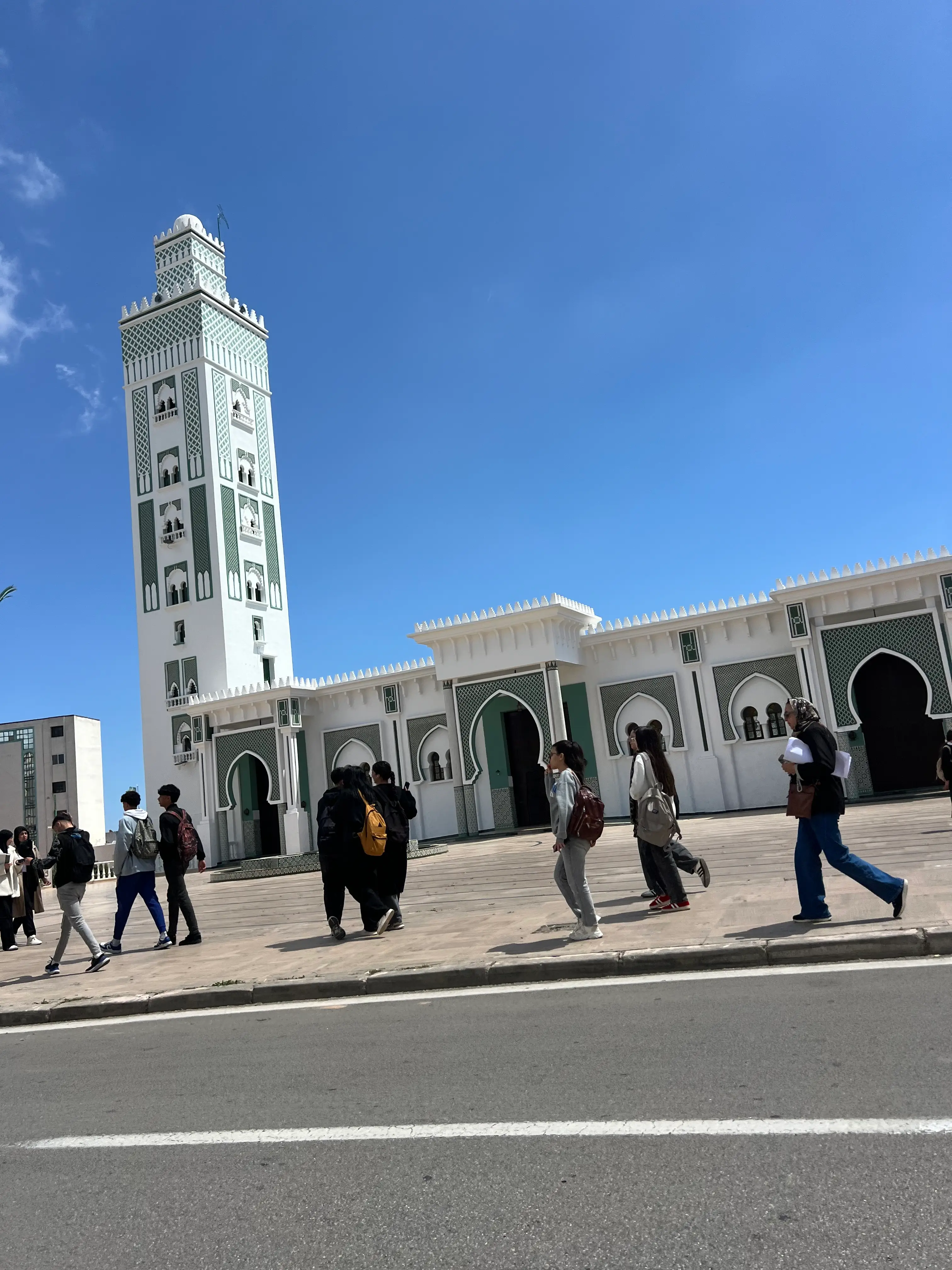 Tourists Visiting Grand Mosque of Tangier with Ornate Minaret